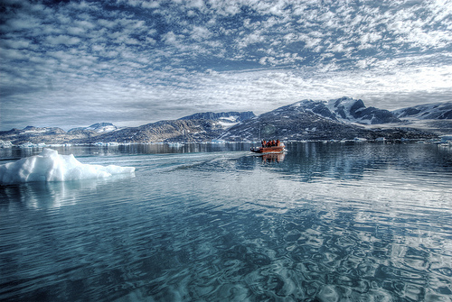 Small boat in the Arctic Sea near Eastern Greenland