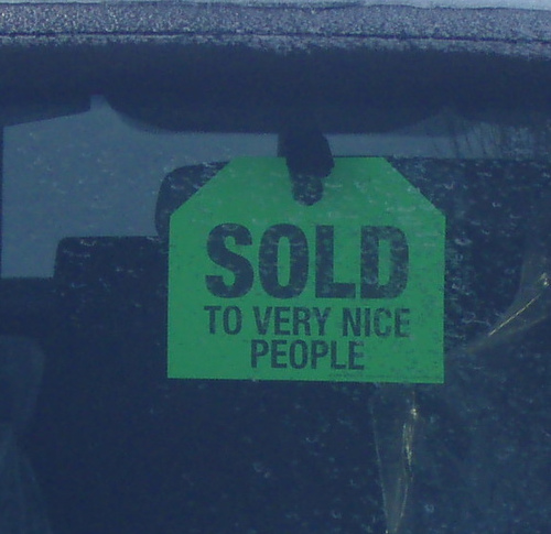 Sold sign in car window