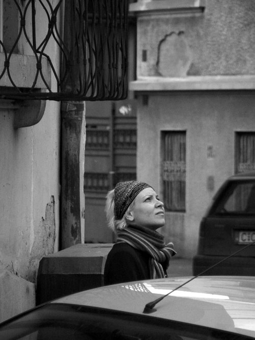 Girl staring up on Bucharest, staring up