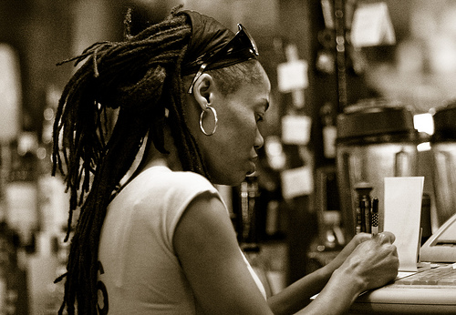 Female bartender taking orders in New York City, New York