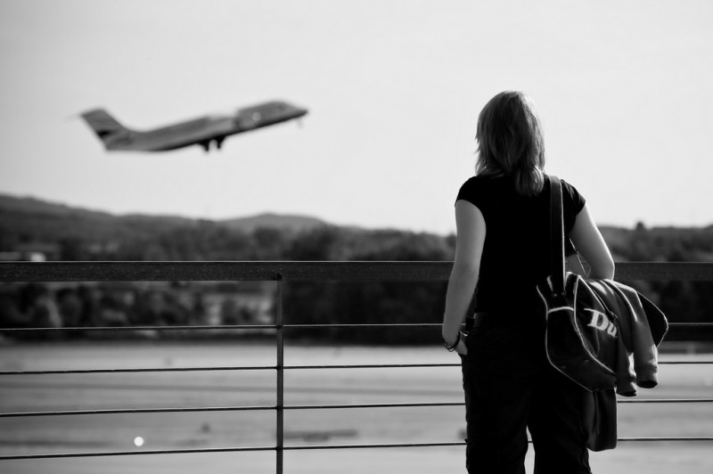 Girl Watching Airplane Take Off in Zurich