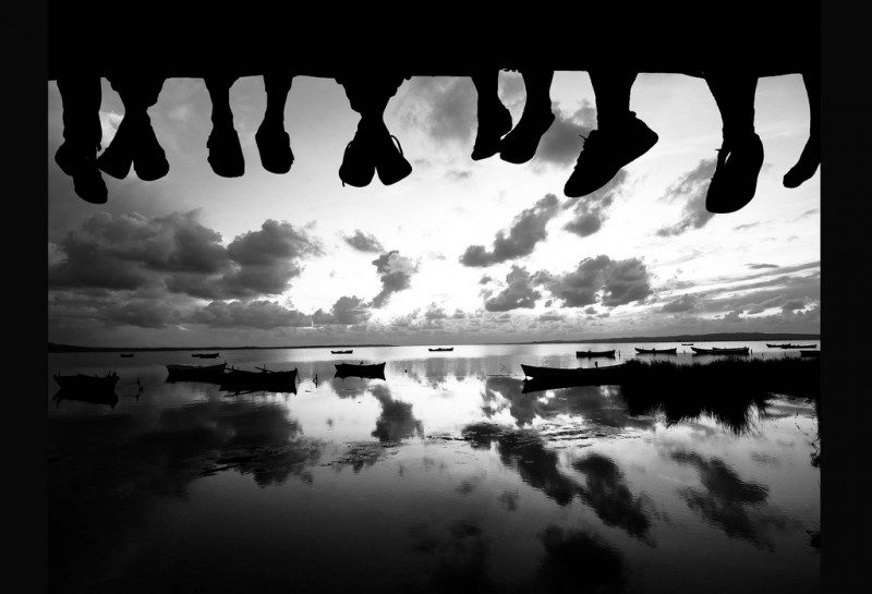 Hanging Out Together Feet dangling off a pier