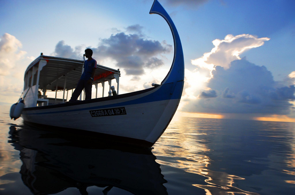 Man on a boat, Maldives