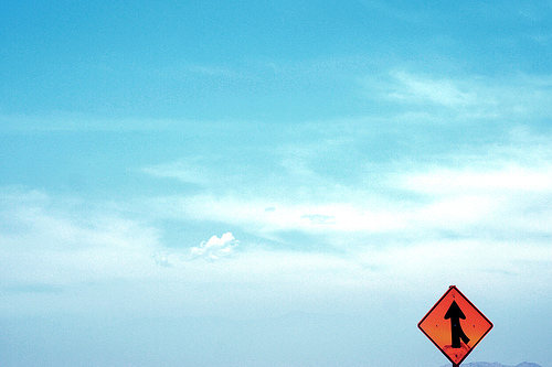 Merge Sign Against Sky