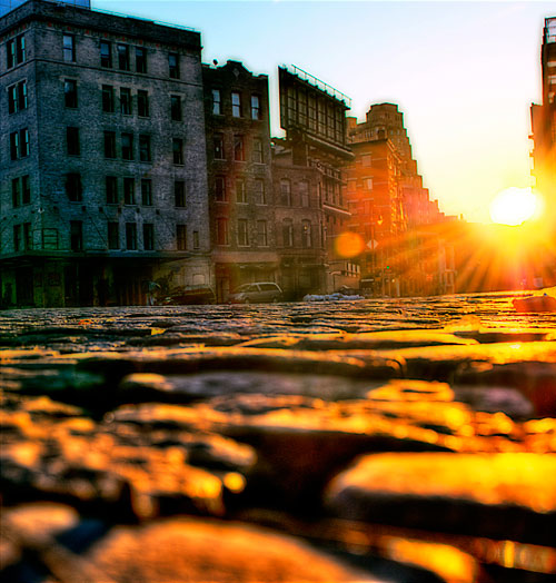 Ground level looking into the sunrise in the meat packing district in NYC