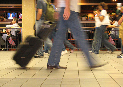 Blurry Traveler Moving through Airport