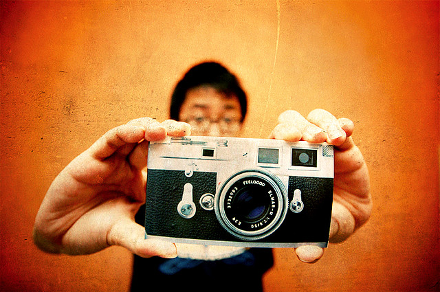 New Camera Man holding new camera