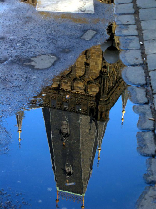 Reflection of Prague in Blue Puddle