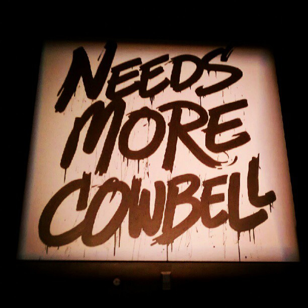 "Needs more cowbell" (sign)