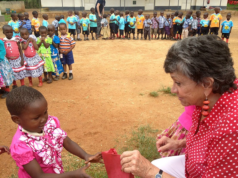 Sylvia Allen handing out Christmas gift bags to the children Sylvia Allen handing out Christmas gift bags to the children