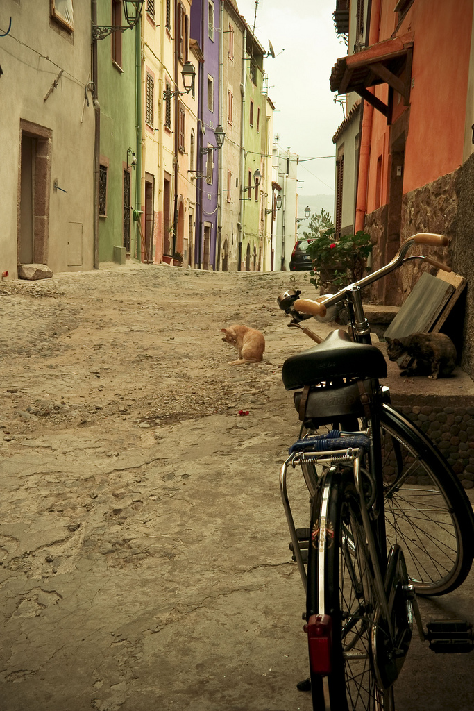 Bike in alley on streets of Alghero in Sardinia, Italy