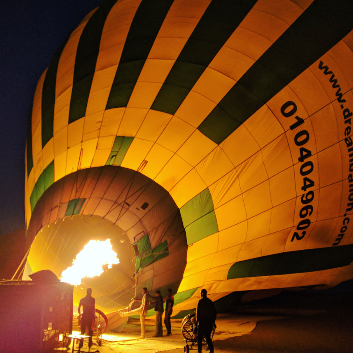Team blowing up the hot air balloon before a sunrise flight over Luxor