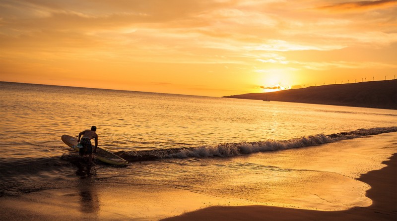 Prepping to Standup Paddleboard Sugar Beach, Maui, Hawaii Prepping to Standup Paddleboard Sugar Beach, Maui, Hawaii