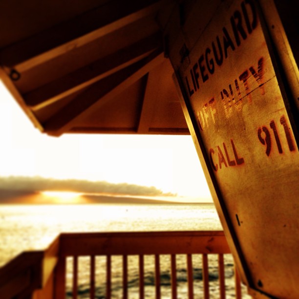 Sunset falls on a shuttered lifeguard shack in Maui, Hawaii Sunset falls on a shuttered lifeguard shack in Maui, Hawaii