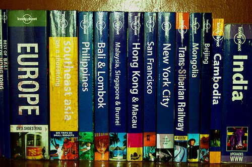 Old Travel Guidebooks on a Shelf