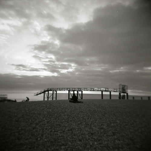 Working, Brighton Beach Person using laptop on Brighton Beach